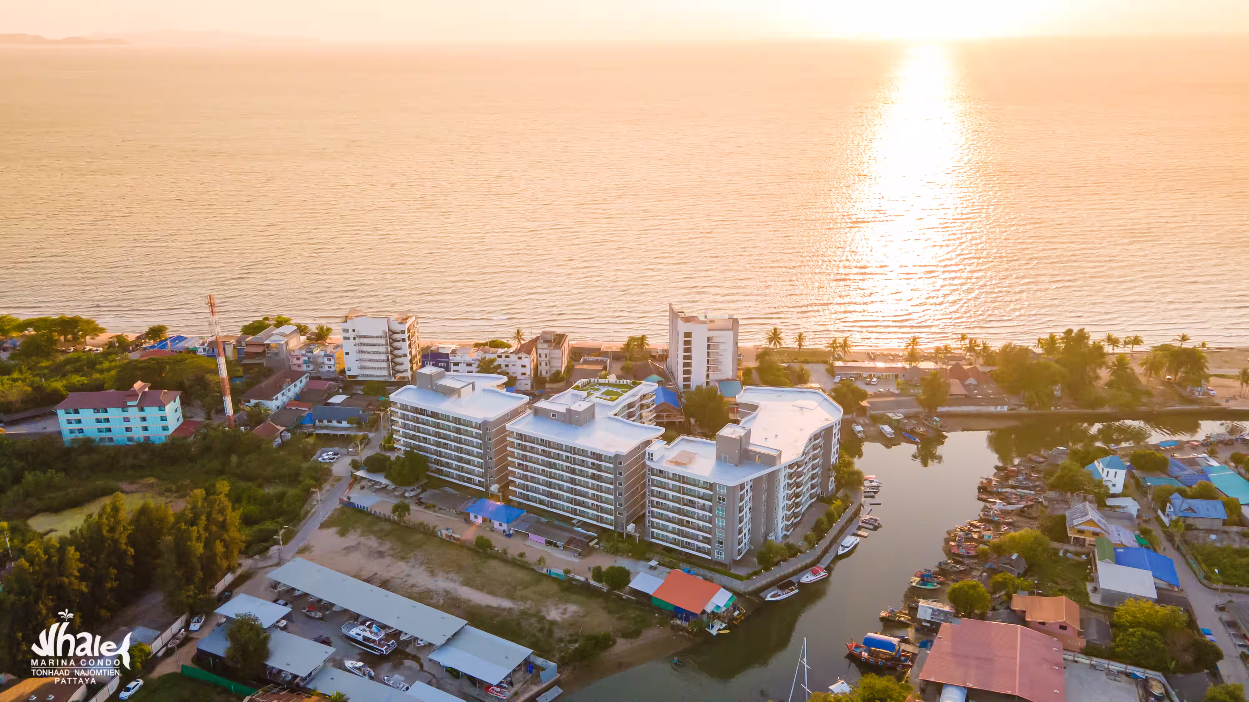 Whale Marina Condo with pool views and green spaces